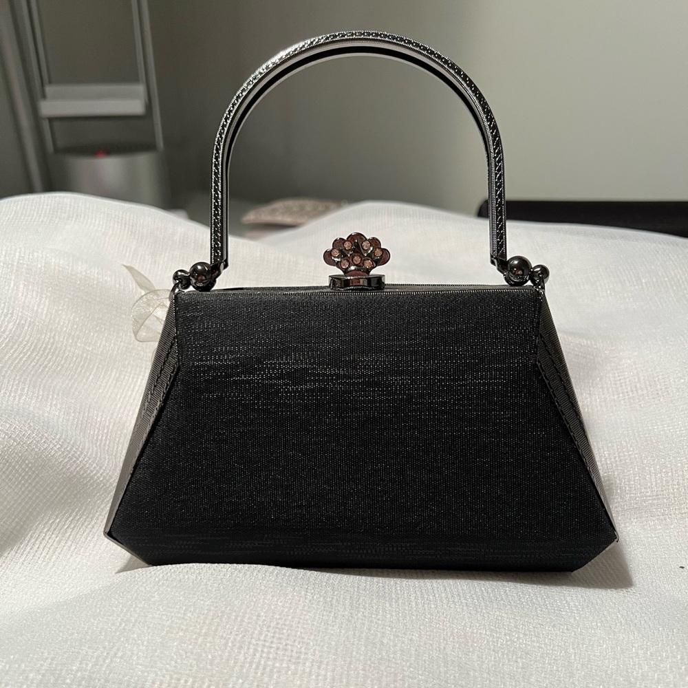 Black satin and silver small handbag. With metal handle